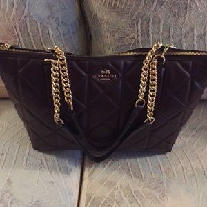 Purple/burgundy colored coach bag